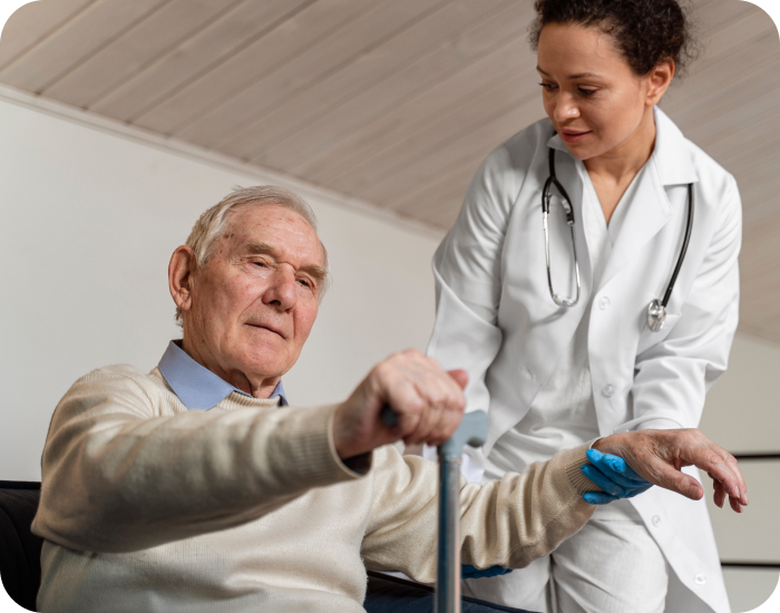 Healthcare worker assisting senior man