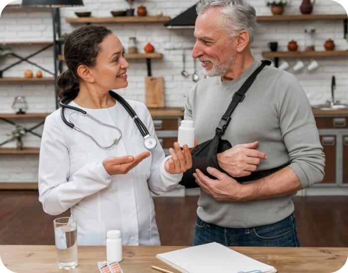Healthcare professional discussing medication with a senior.