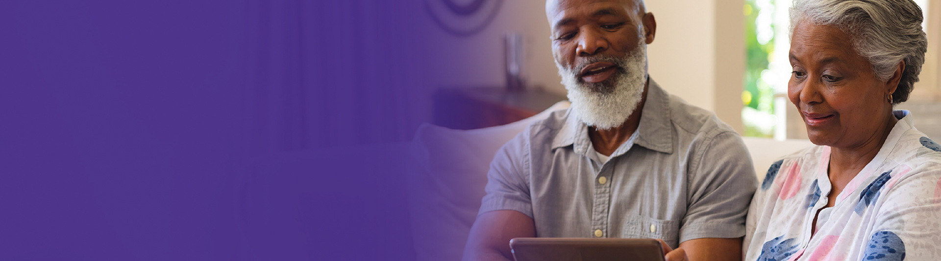 Older couple enjoying time together with a tablet.