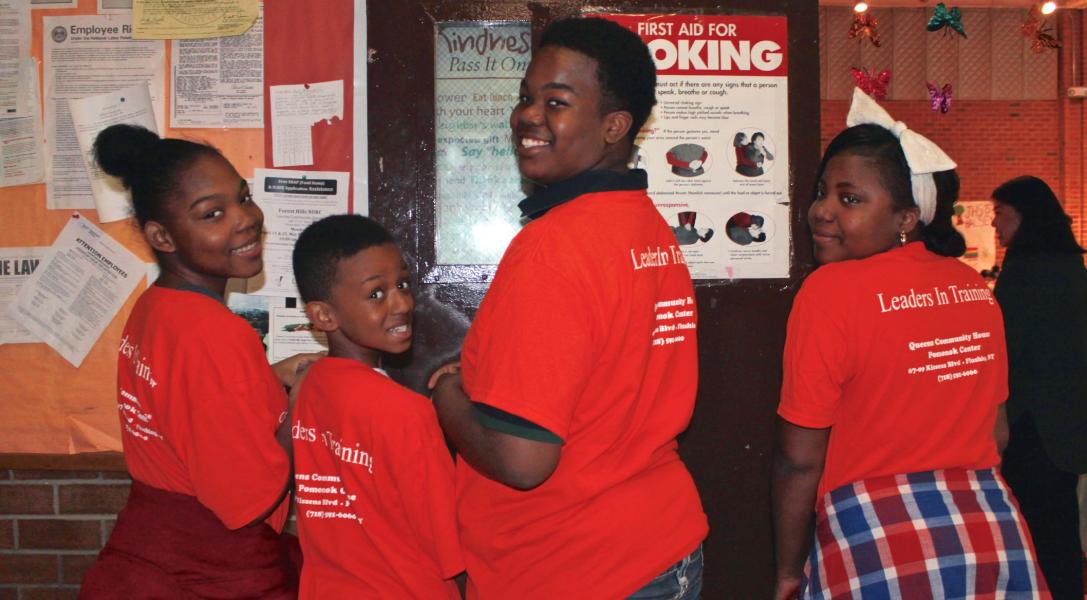 Youth participants in training shirts in common area