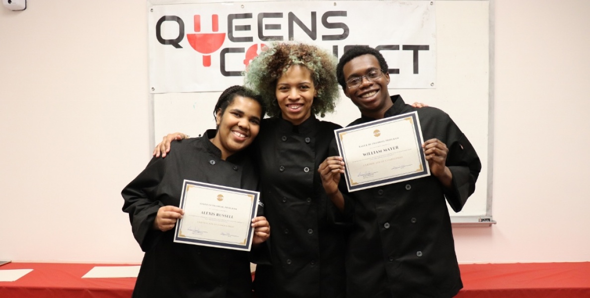 Staff members celebrating with certificates