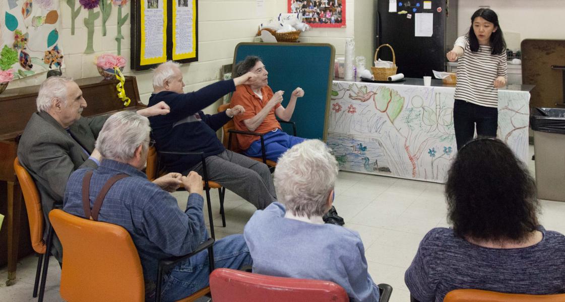 Residents and staff engaged in a lively activity session.