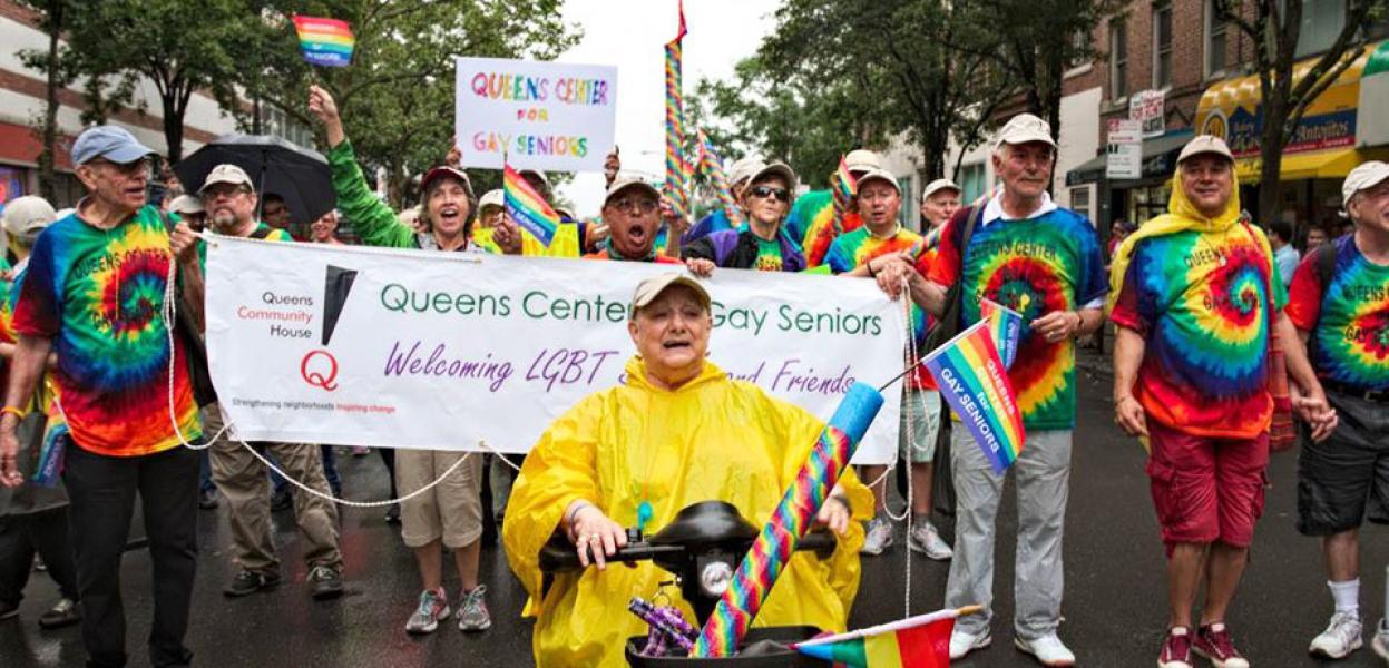 Seniors participating in a colorful pride parade