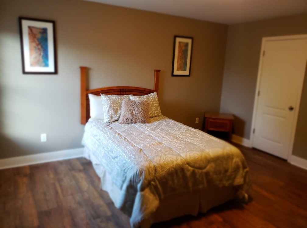 Cozy private room with bed and decor
