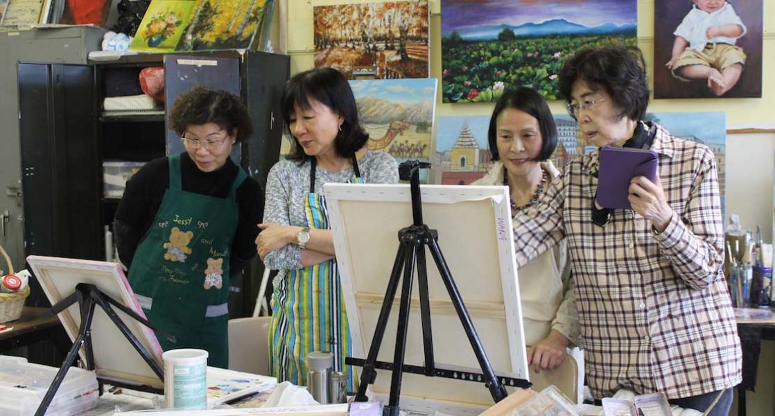 Residents engaging in an art activity together