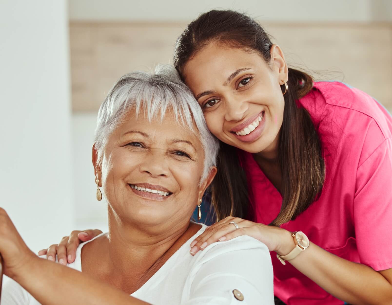 Smiling caregiver with elderly resident