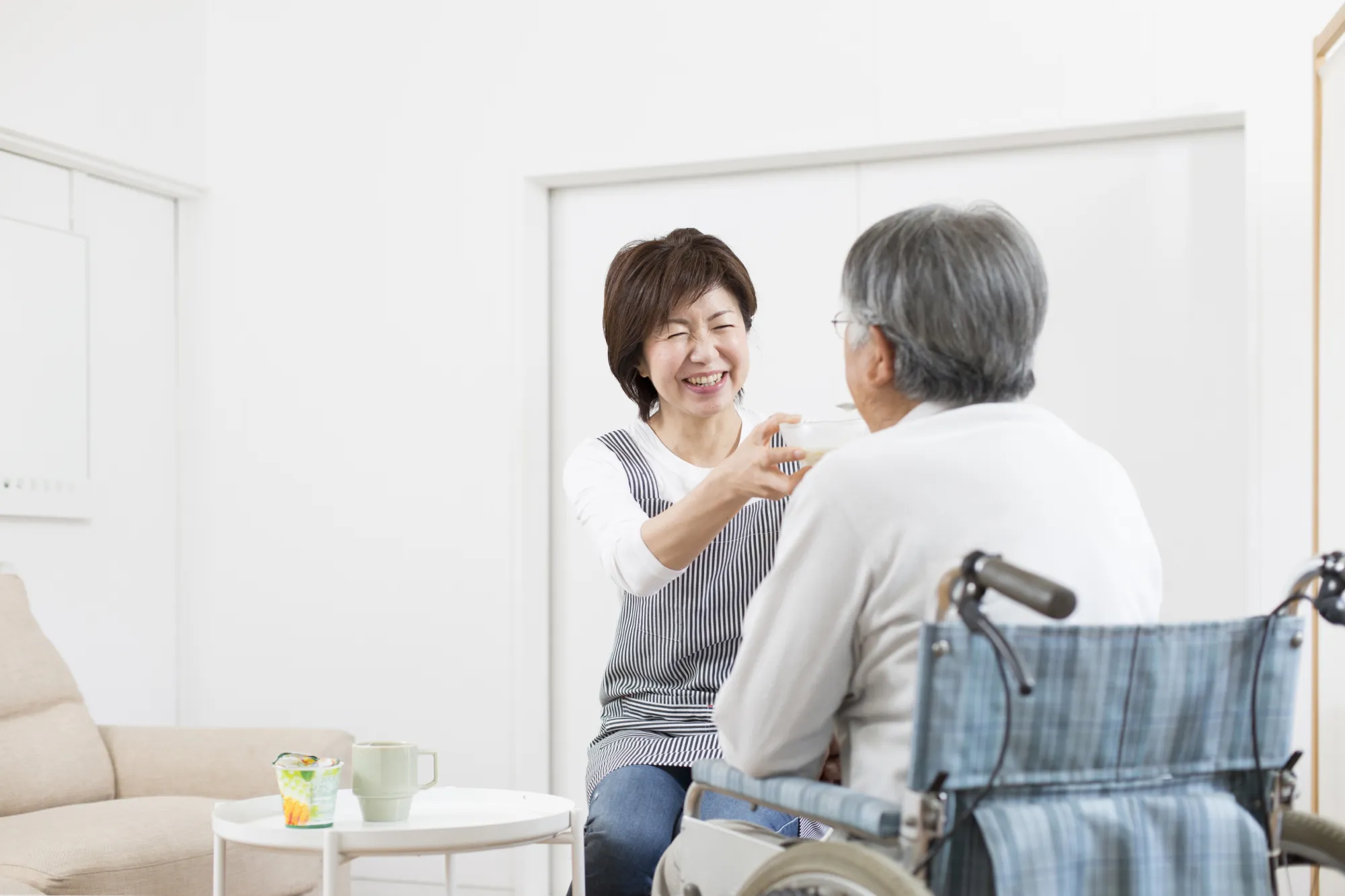 Caregiver interacting with a resident in a cozy room