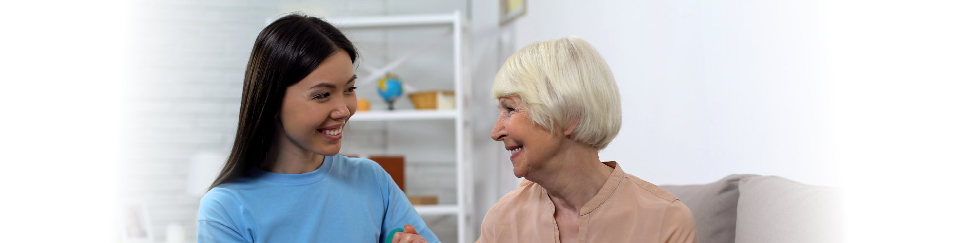 A caregiver interacting with an elderly resident.