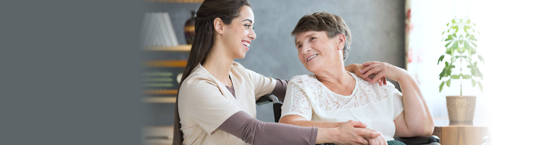 Caregiver and senior resident sharing a smile