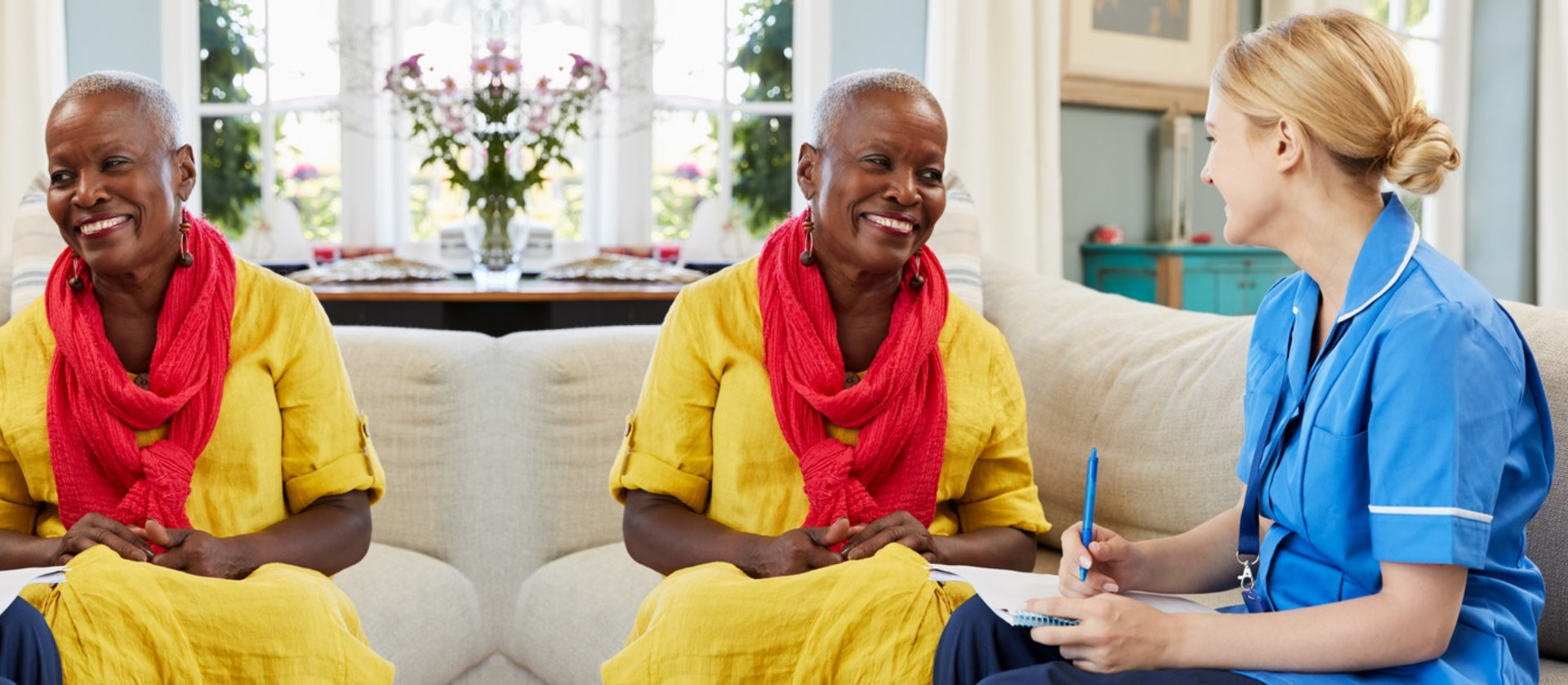 A caregiver and a resident having a conversation.
