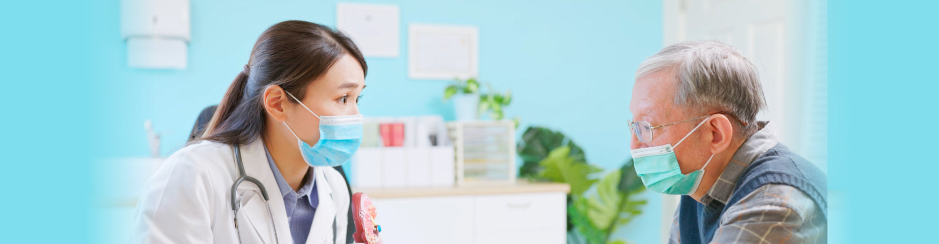 Healthcare professional consulting with senior patient.