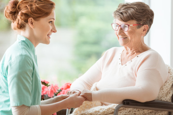 Caregiver and resident engaged in conversation