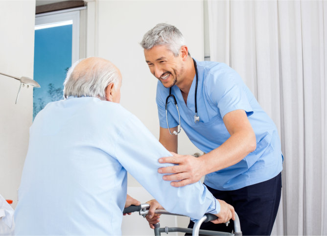 A nurse assisting an elderly patient with a walker
