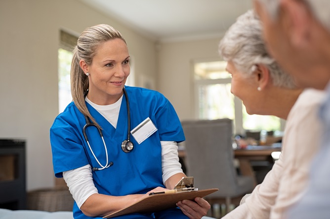 A healthcare professional interacting with a resident.