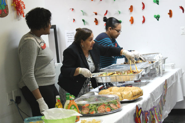 Staff serving food at a community event