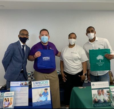 Staff members posing at an information booth