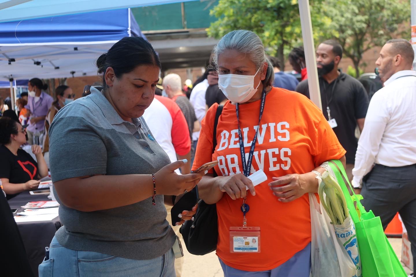 People interacting at an outdoor event.