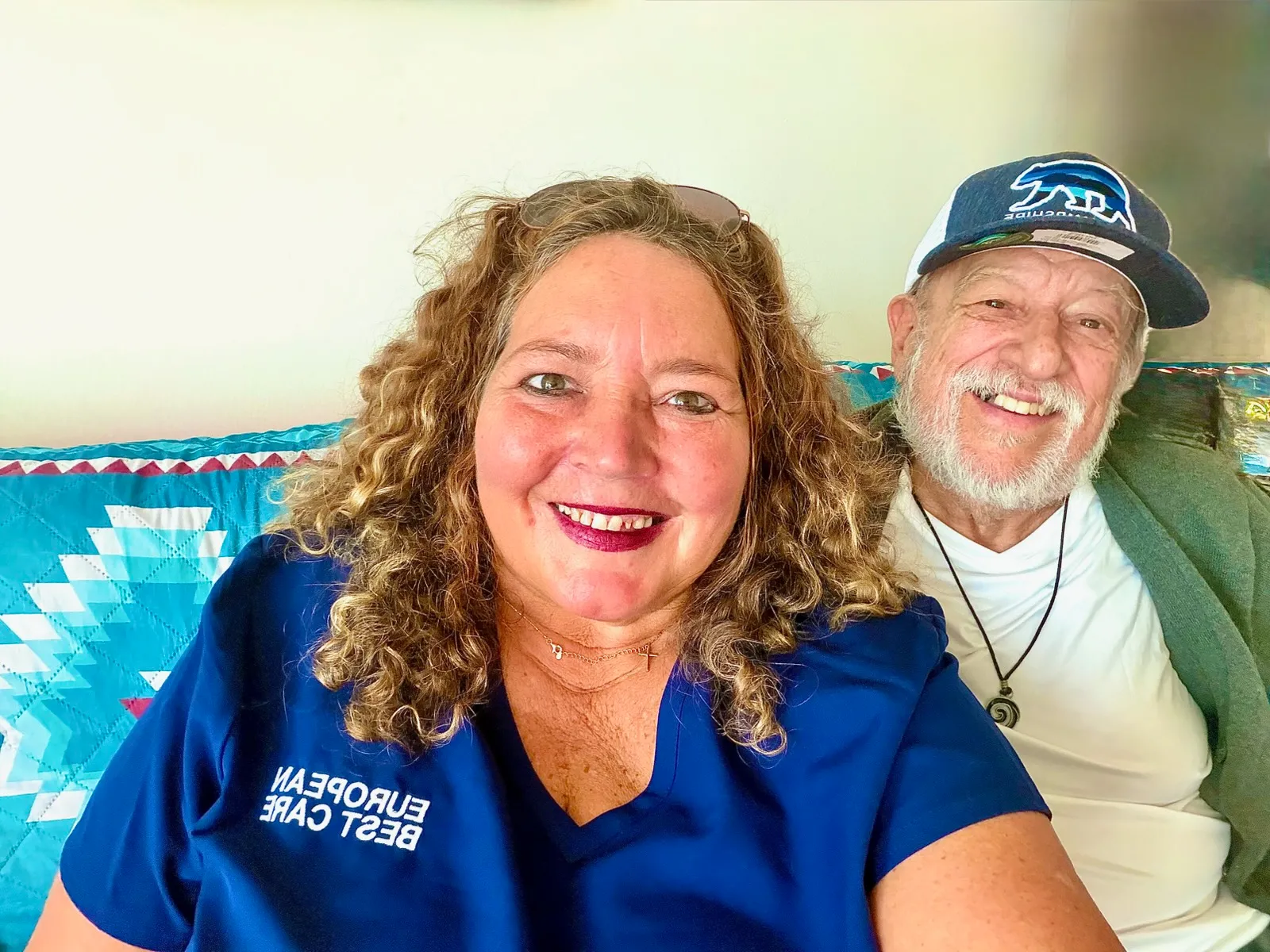 Smiling staff member with a resident indoors