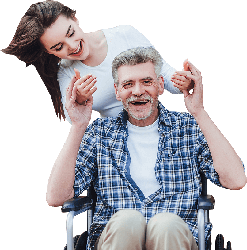 Happy elderly man in wheelchair with caregiver.