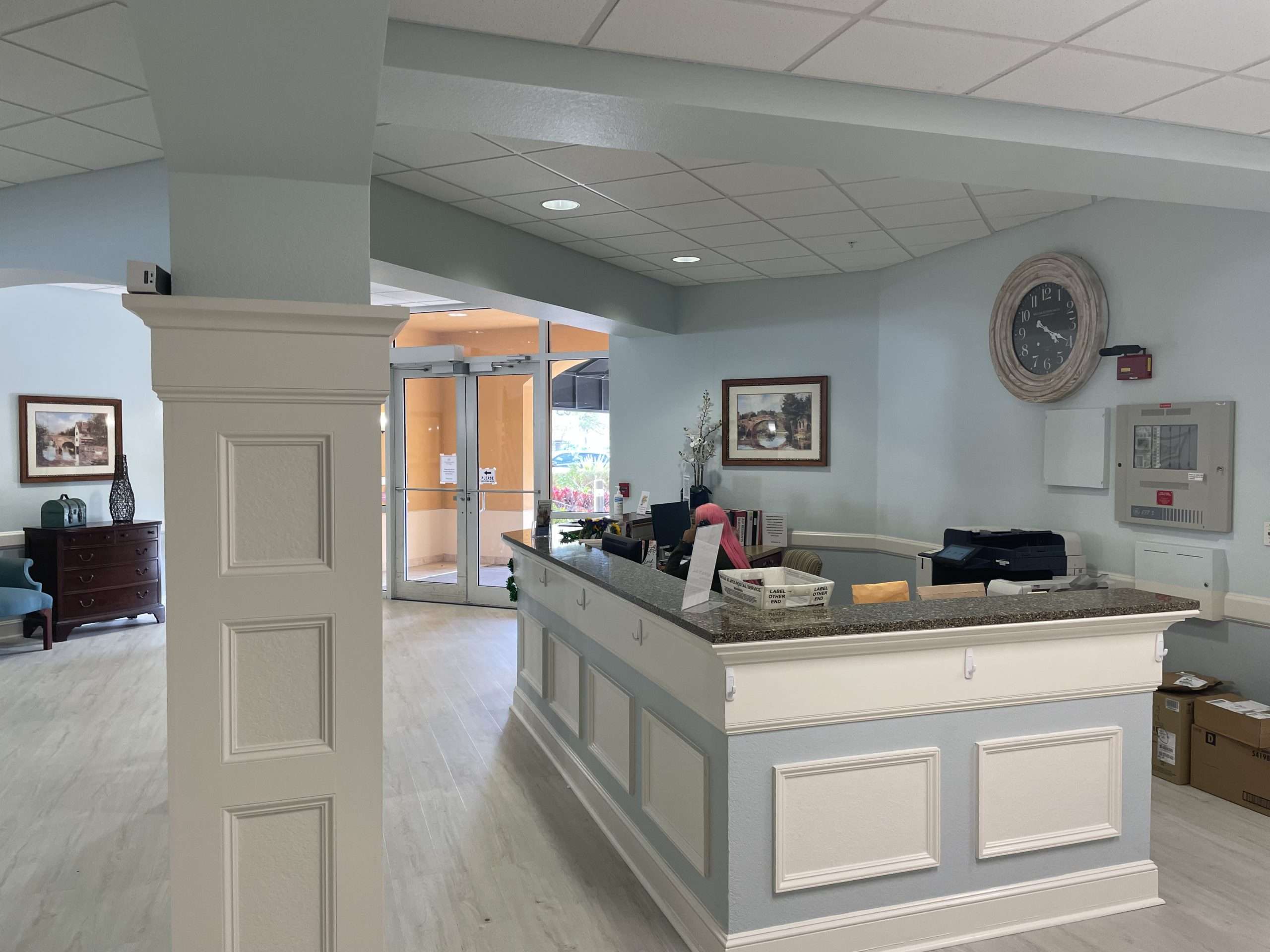Reception area with a front desk and seating