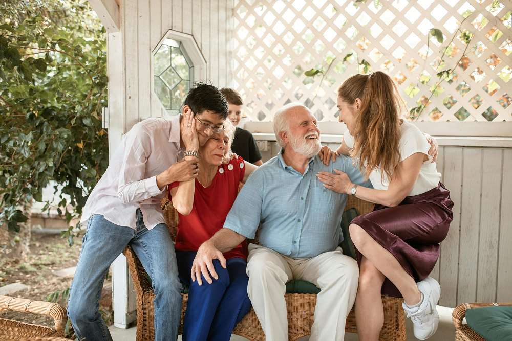 Residents and staff enjoying time together outdoors.