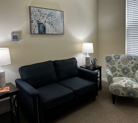 Cozy sitting area with a couch and artwork