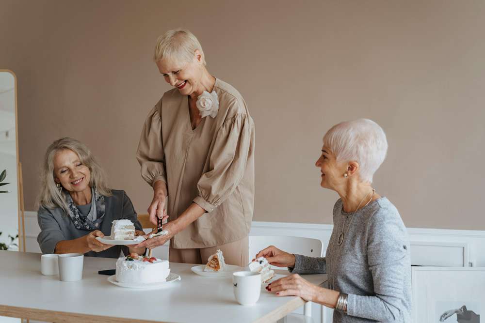 Residents enjoying cake and conversation
