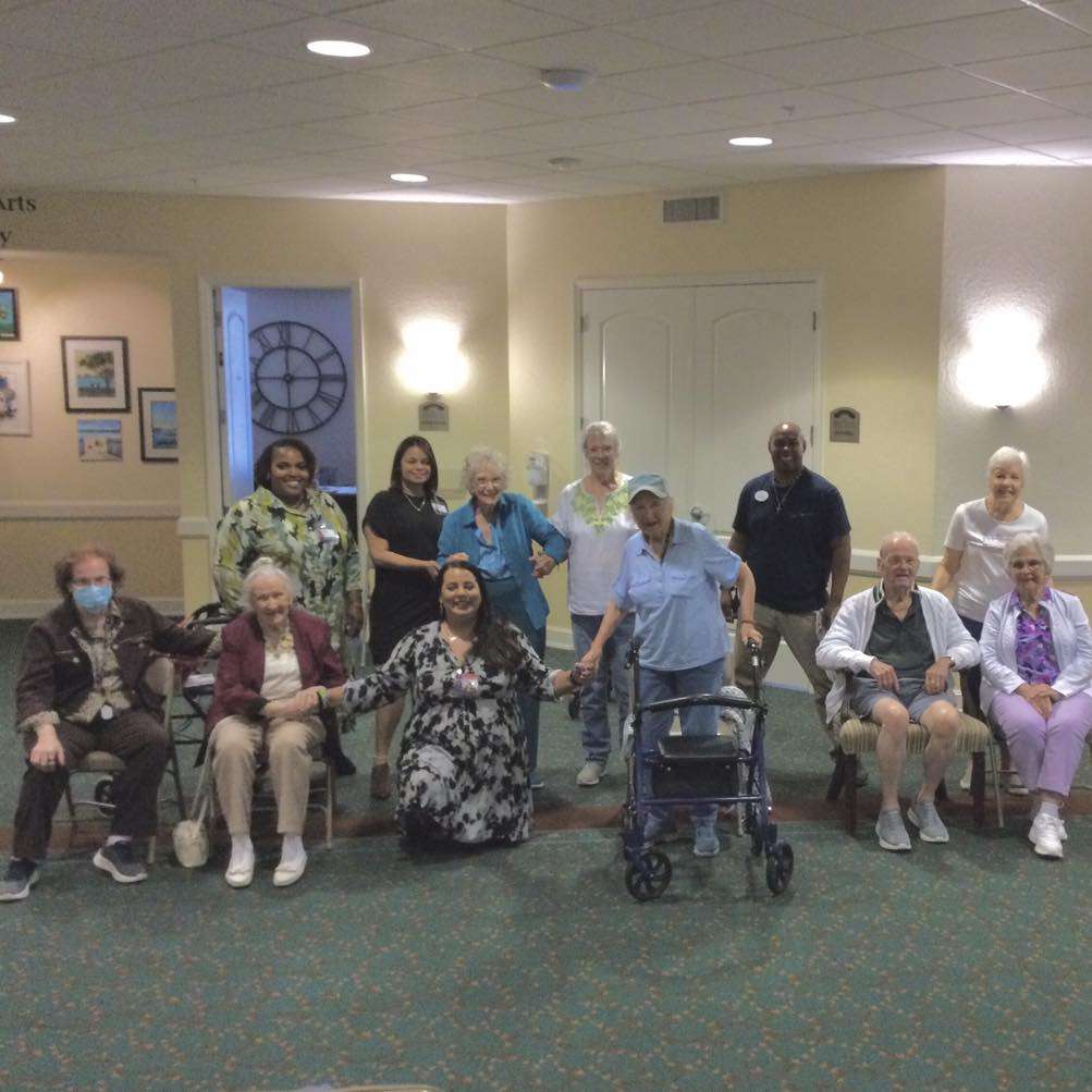 Group of residents and staff in a common area