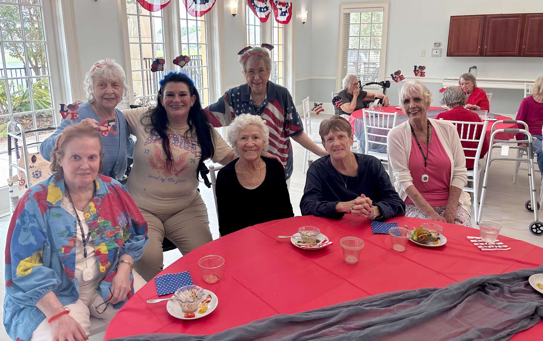 Residents enjoying a meal together at a dining table.