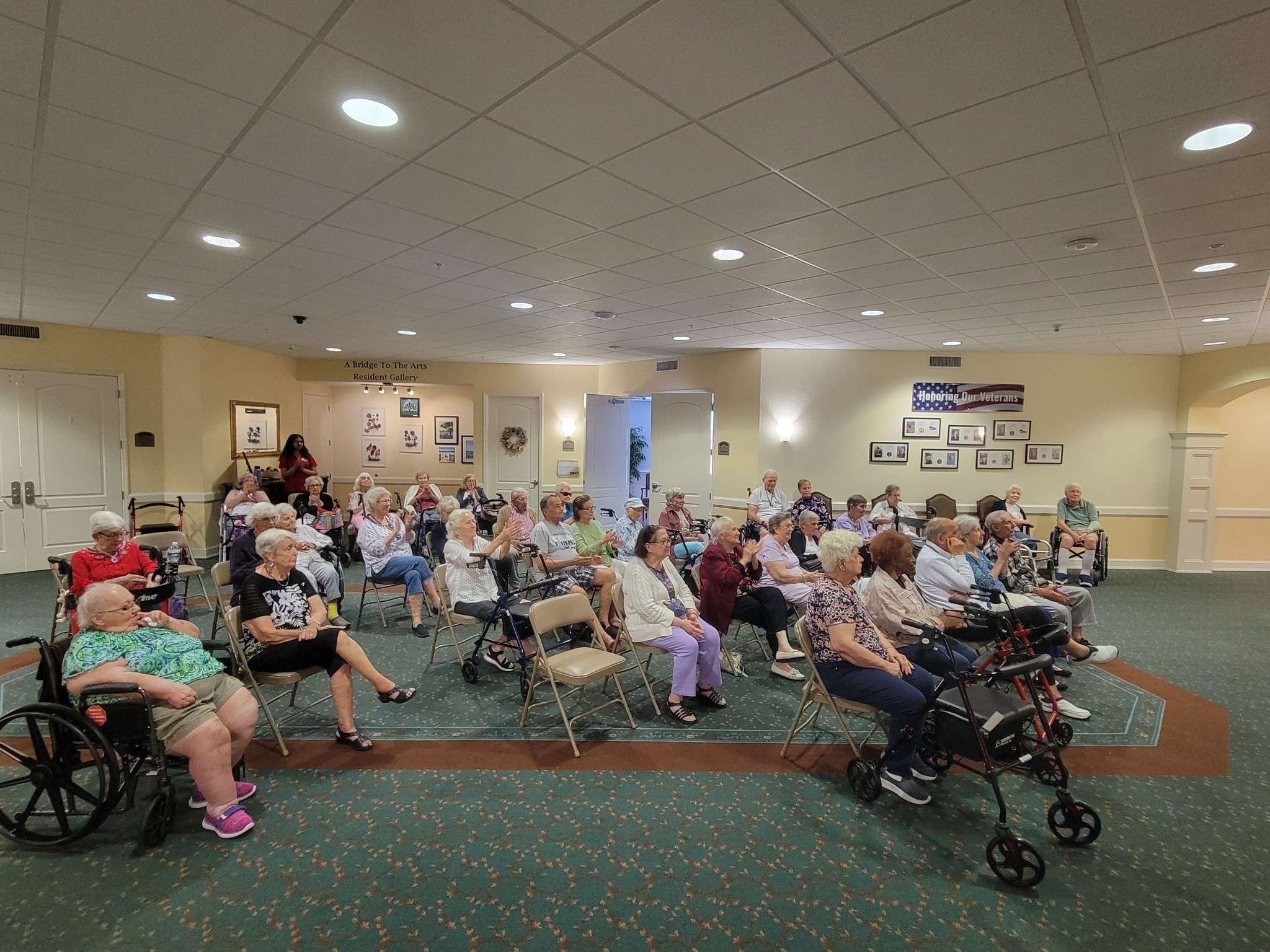 Residents seated together in a common area.