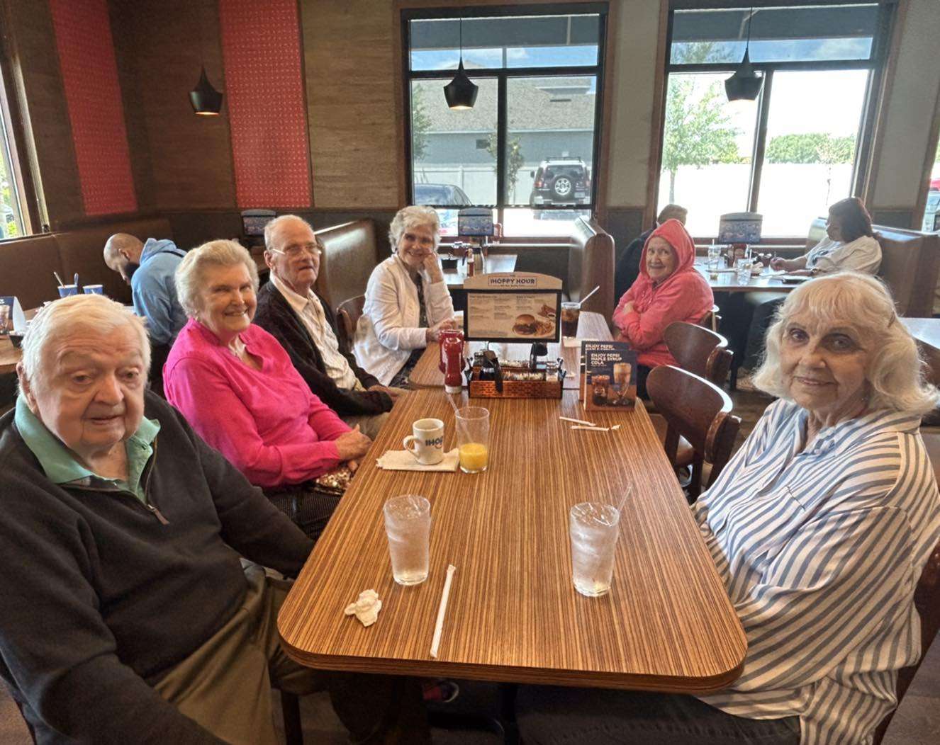 Residents enjoying a meal in the dining room.