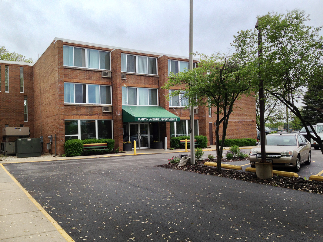 Exterior view of Martin Avenue Apartments with landscaping.
