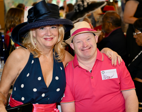 Two individuals dressed up at a social event