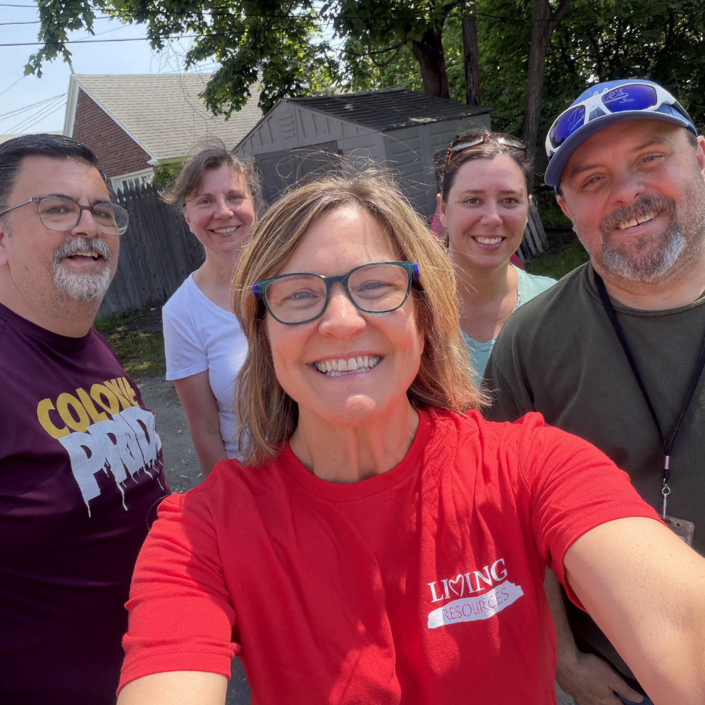 Group photo of staff members outdoors