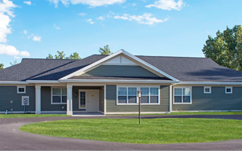 Exterior view of a senior living facility building.