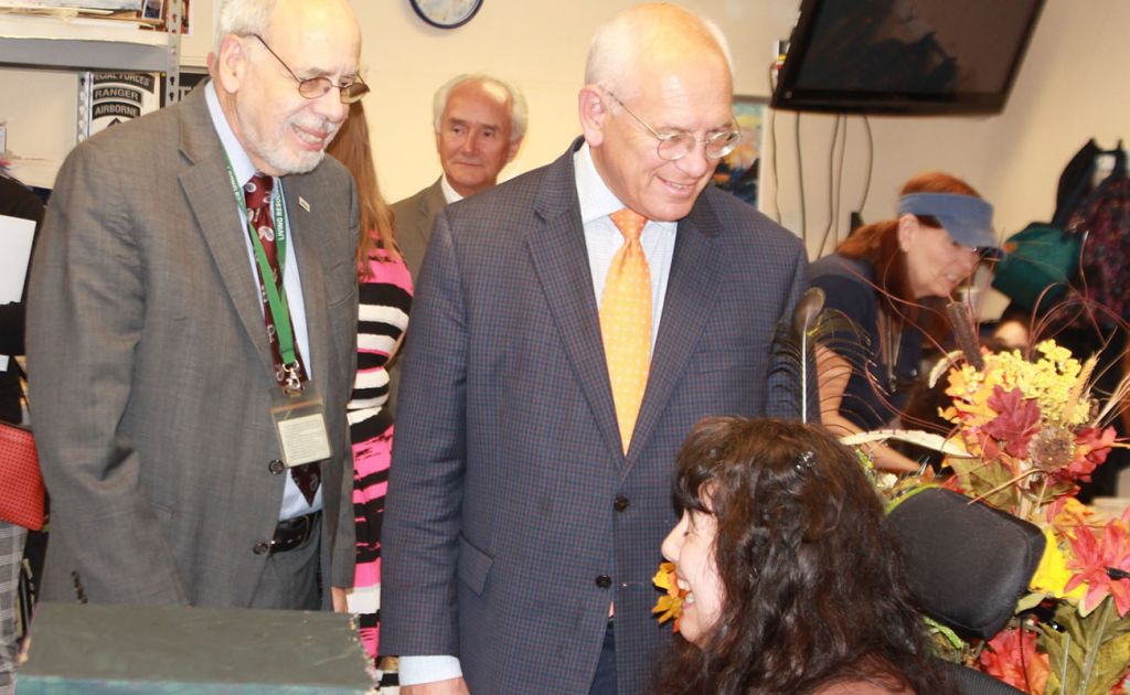 Residents and staff engaged in conversation during an event.