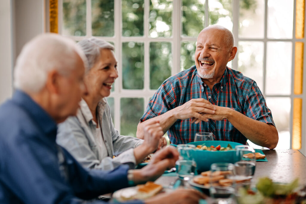 Seniors enjoying a meal together at a table