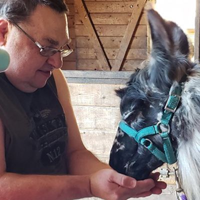 Resident interacting with a therapy animal