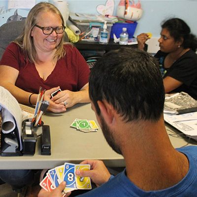Residents participating in a card game activity.