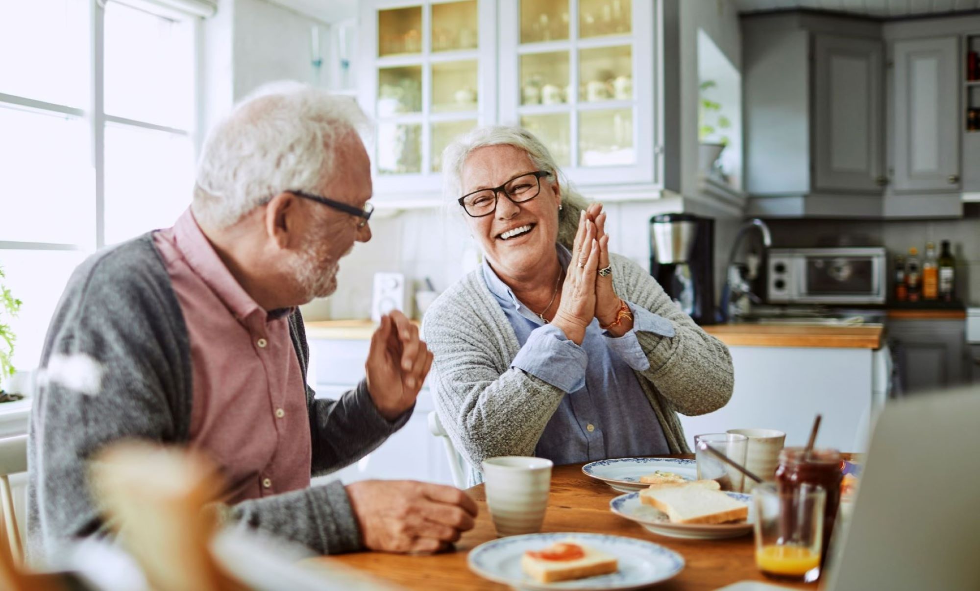 Two seniors enjoying breakfast together