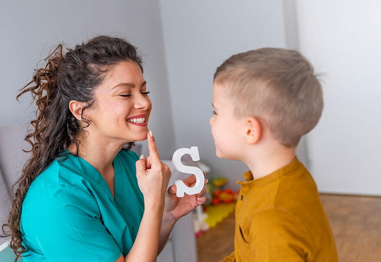 Therapist engaging with a child in a room
