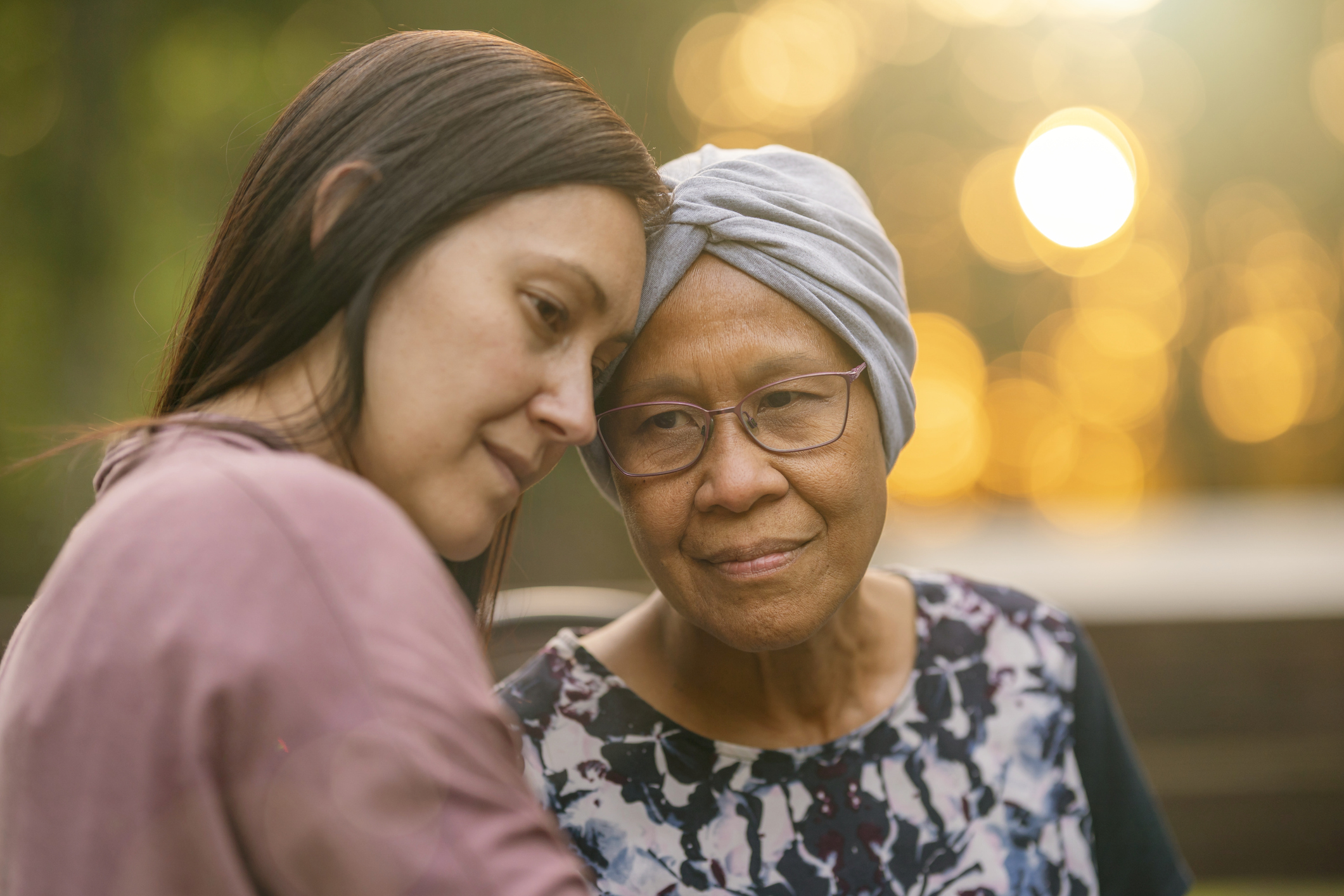 A caregiver and resident sharing a moment outdoors