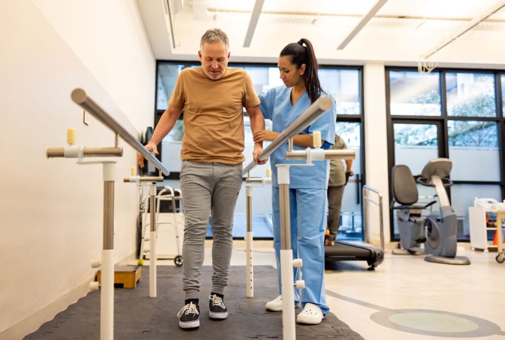 Therapist assisting a resident during rehabilitation exercise.