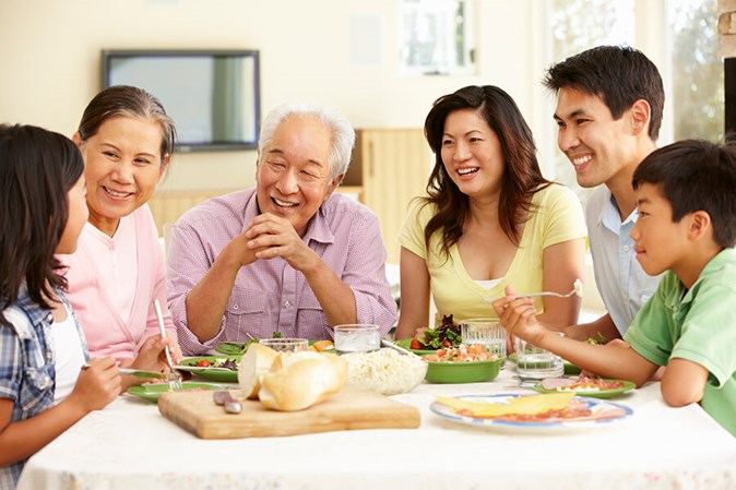 Residents and family enjoying a meal together