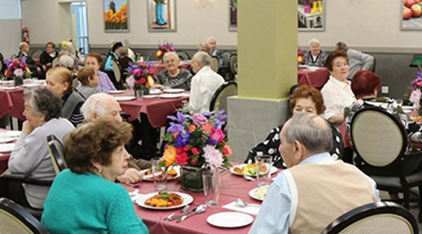 Residents enjoying a meal in the dining room