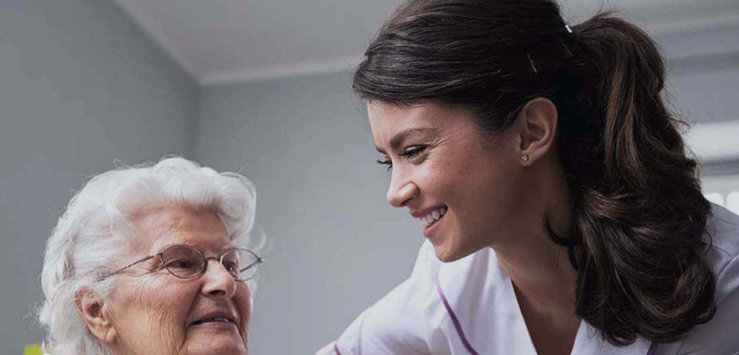 Caregiver interacting with a senior resident