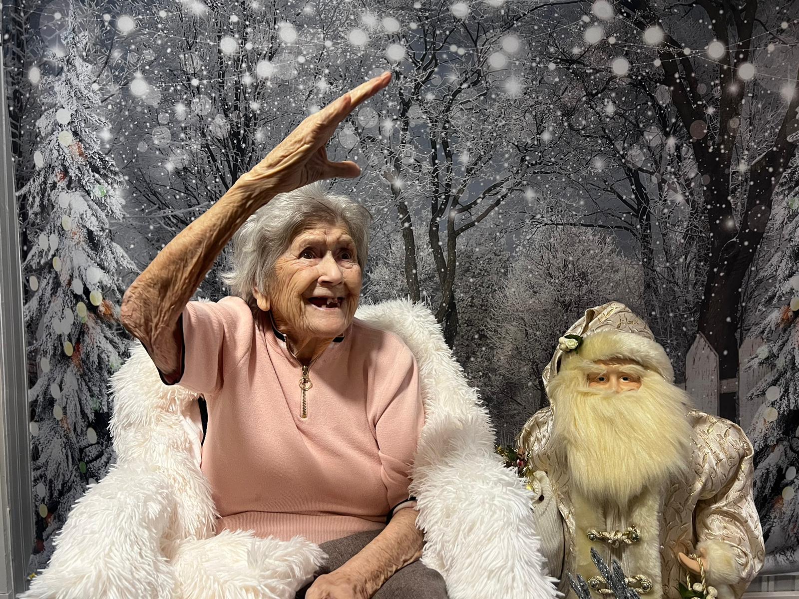 Resident celebrating with a festive decoration.