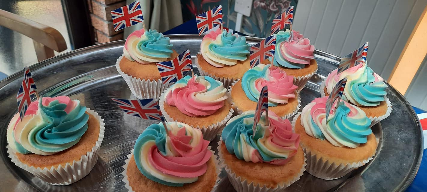 Colorful cupcakes topped with flags