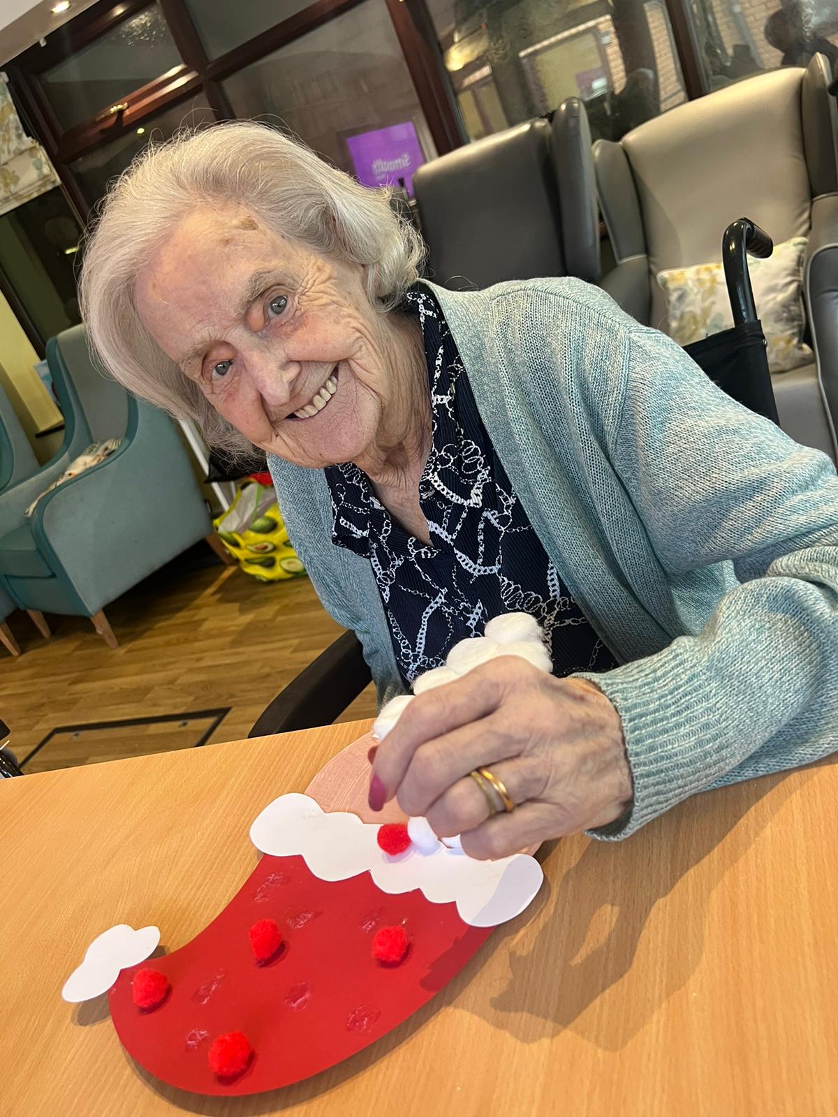 Resident engaging in an arts and crafts activity.