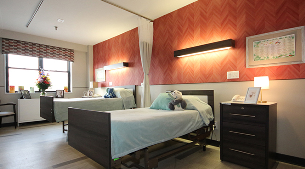 Cozy shared bedroom with two beds and decor.